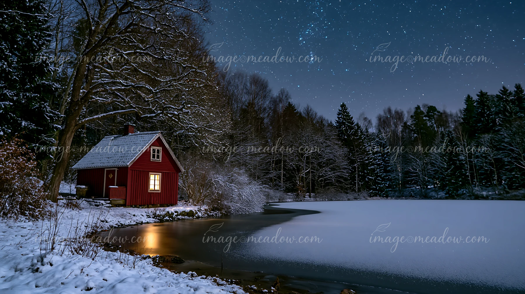 A snow-covered cabin under stars stands near a frozen lake surrounded by trees.