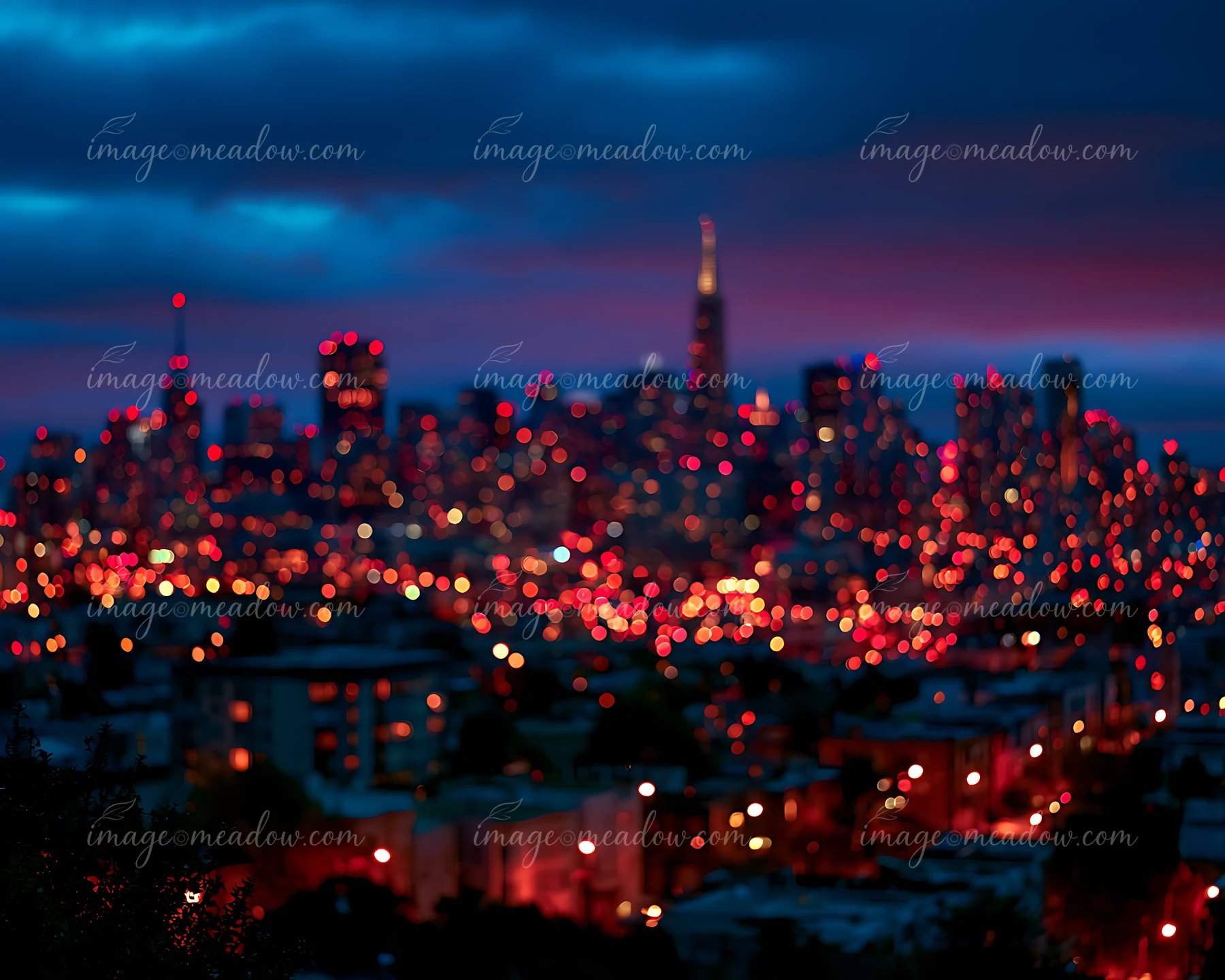 A vibrant city skyline lights up the night sky with numerous red and orange lights.