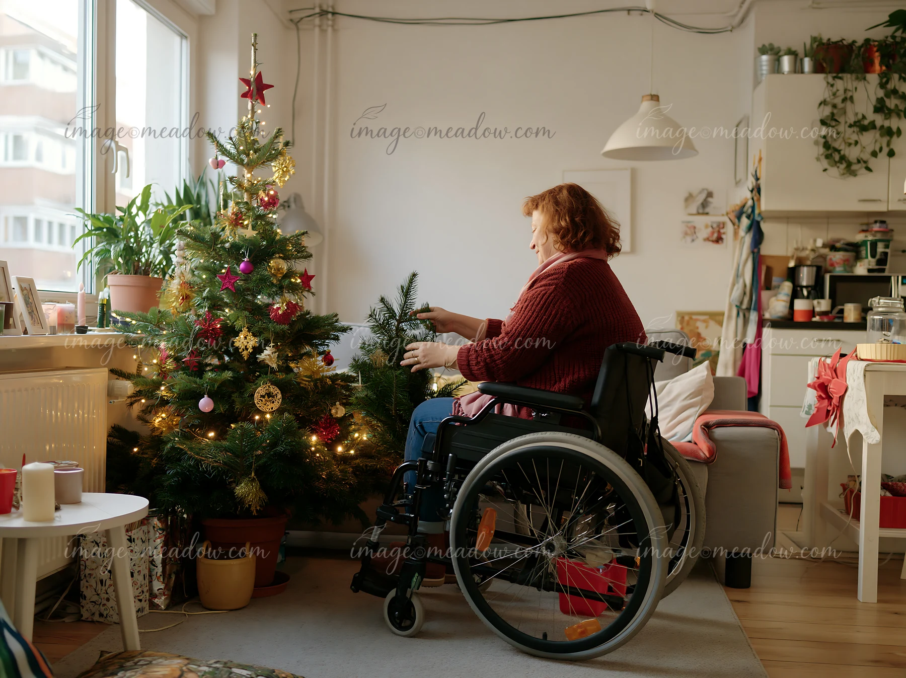 A woman in a wheelchair decorates a small apartment for the holidays.