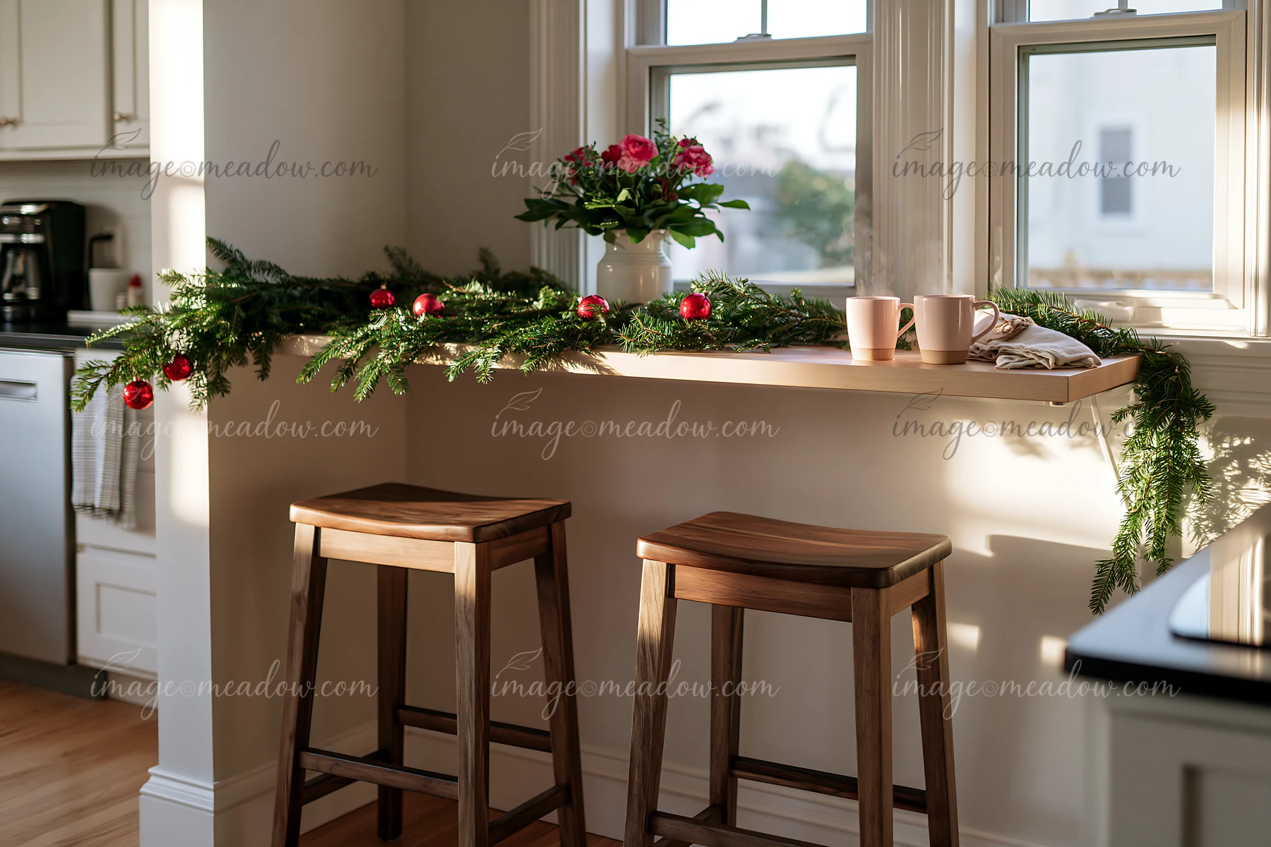 The breakfast bar has greenery and red ornaments, creating a festive atmosphere.