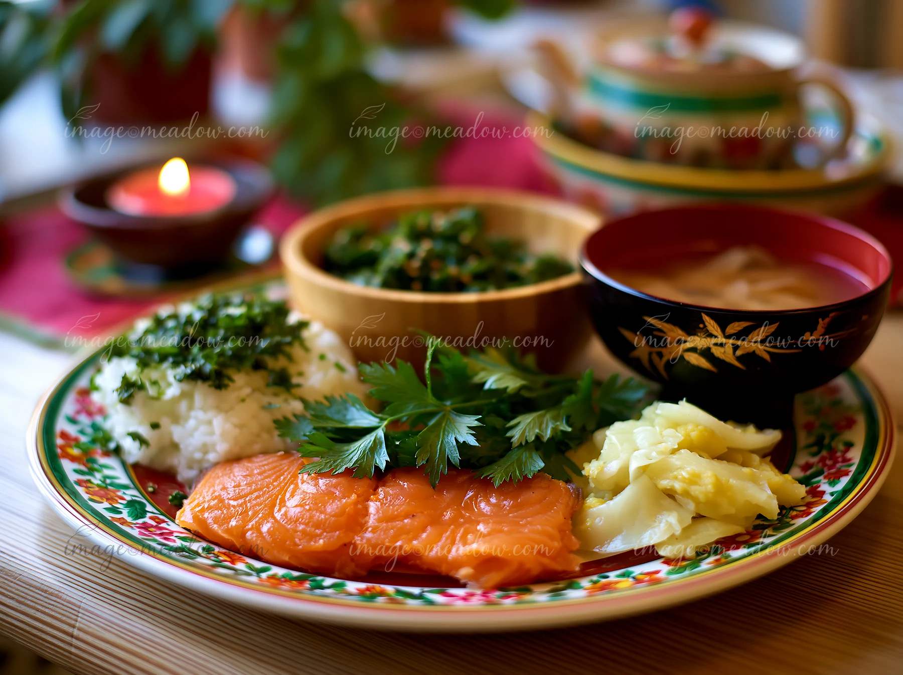 A colorful plate displays salmon, rice, vegetables, and herbs.
