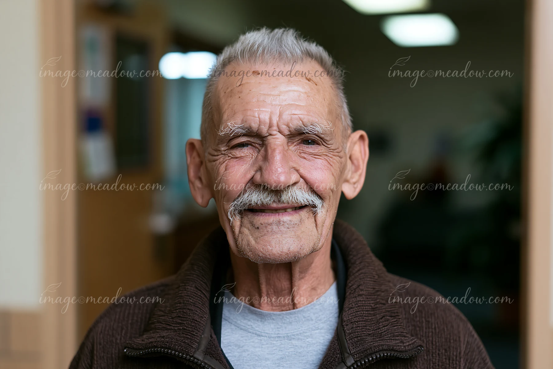 A man smiles during a Parkinson's support group meeting.