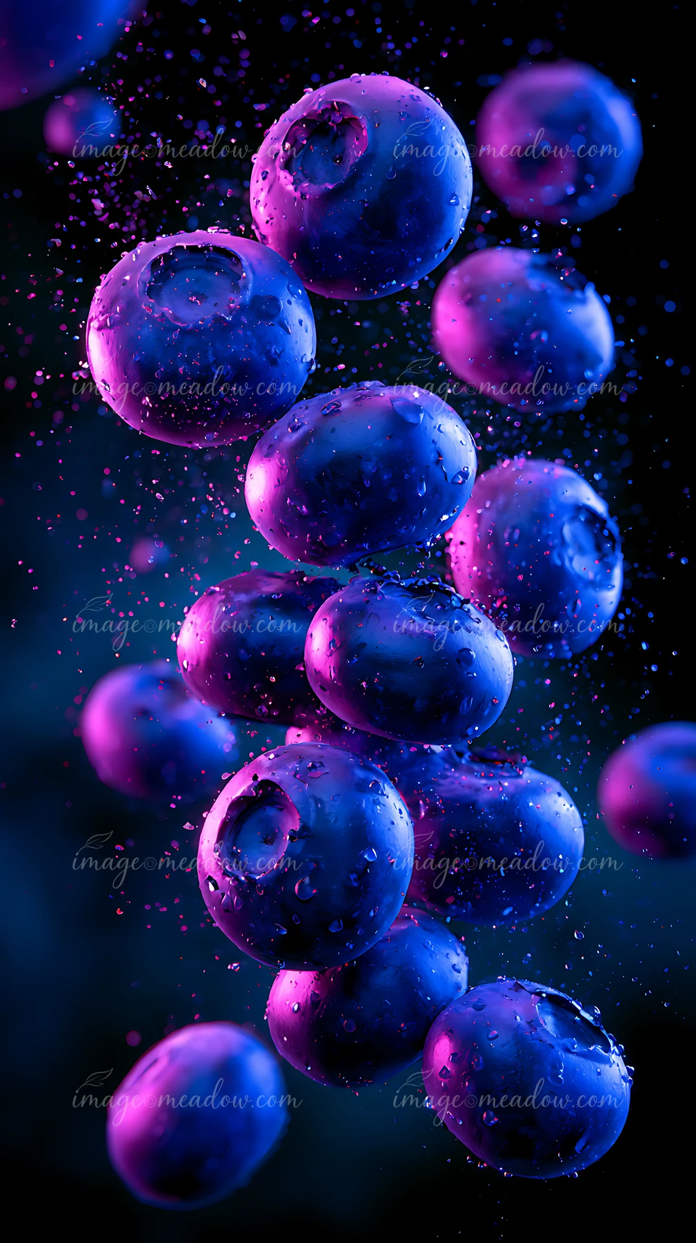 Blueberries are suspended in the air surrounded by vibrant colors and water droplets.