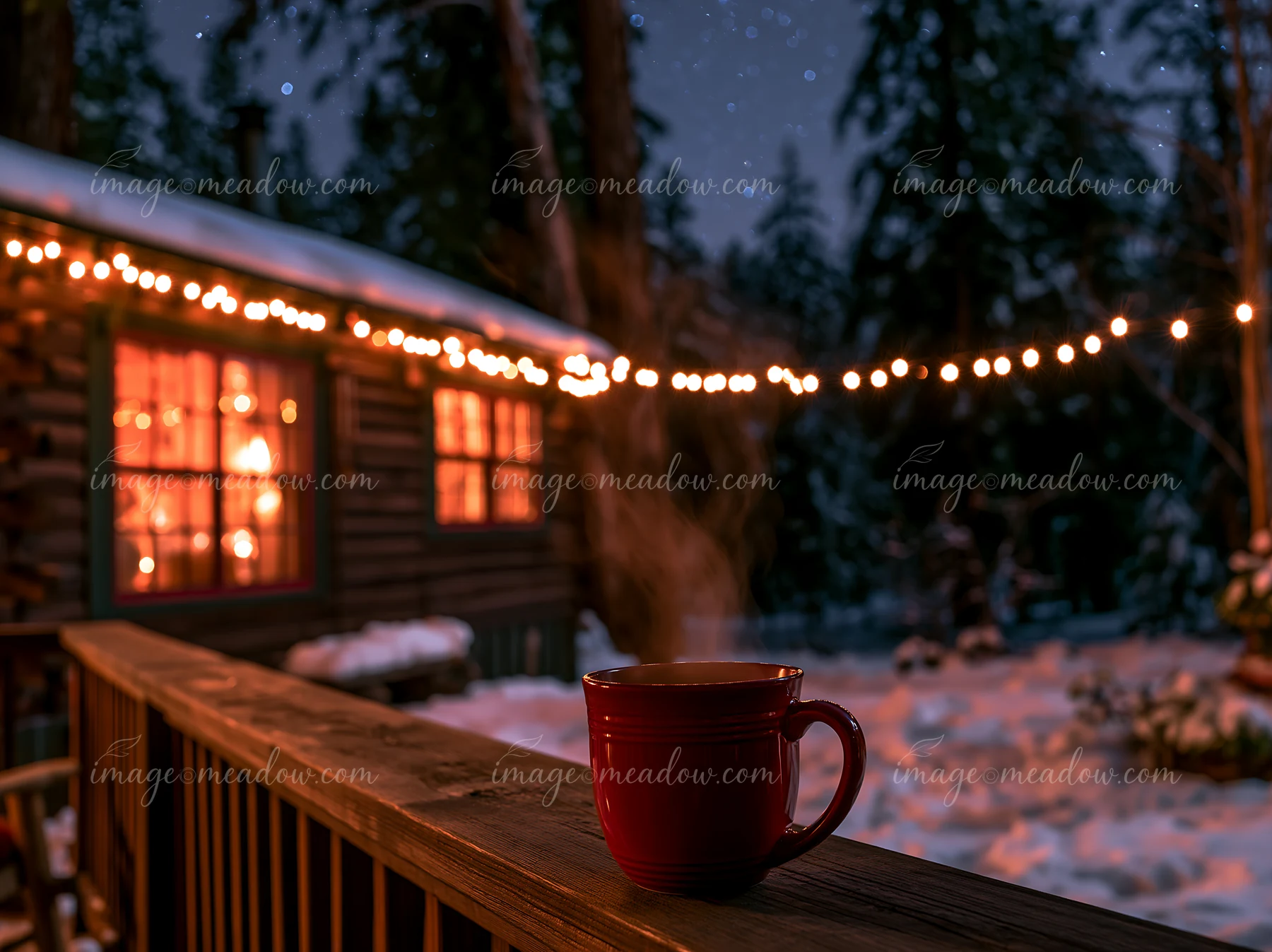 A cabin is surrounded by snow, with lights glowing from its windows.