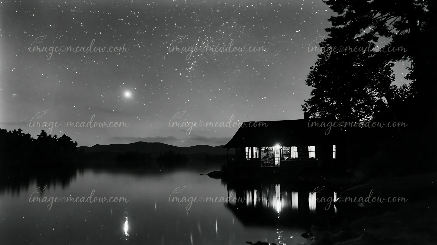 A cottage under stars with an open porch stands near a calm lake, reflecting the night sky.