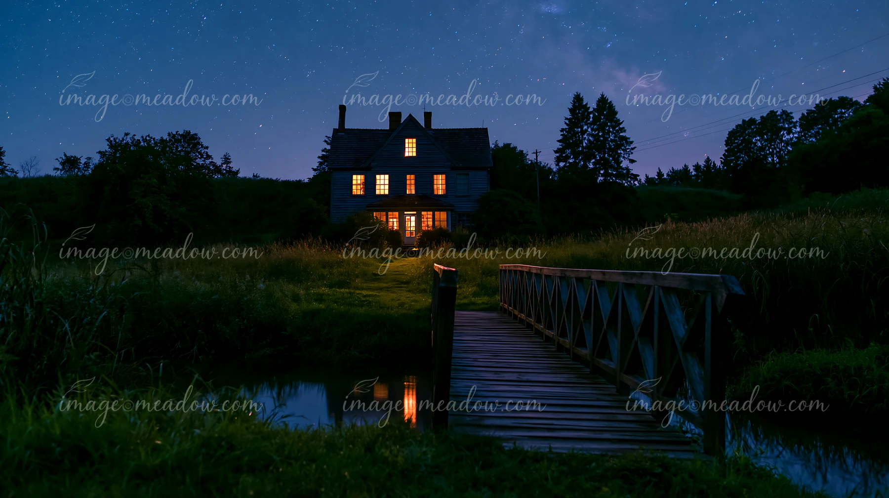 A country house beneath starry sky stands in a field.