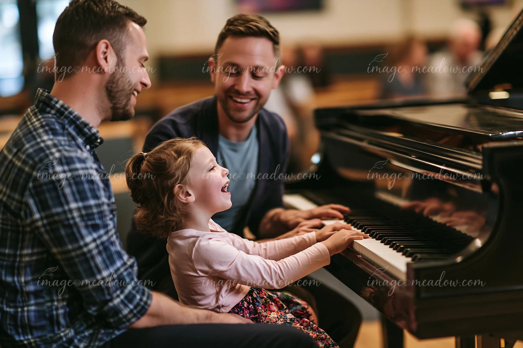 A family is playing piano and singing while smiling at each other in a cozy room.
