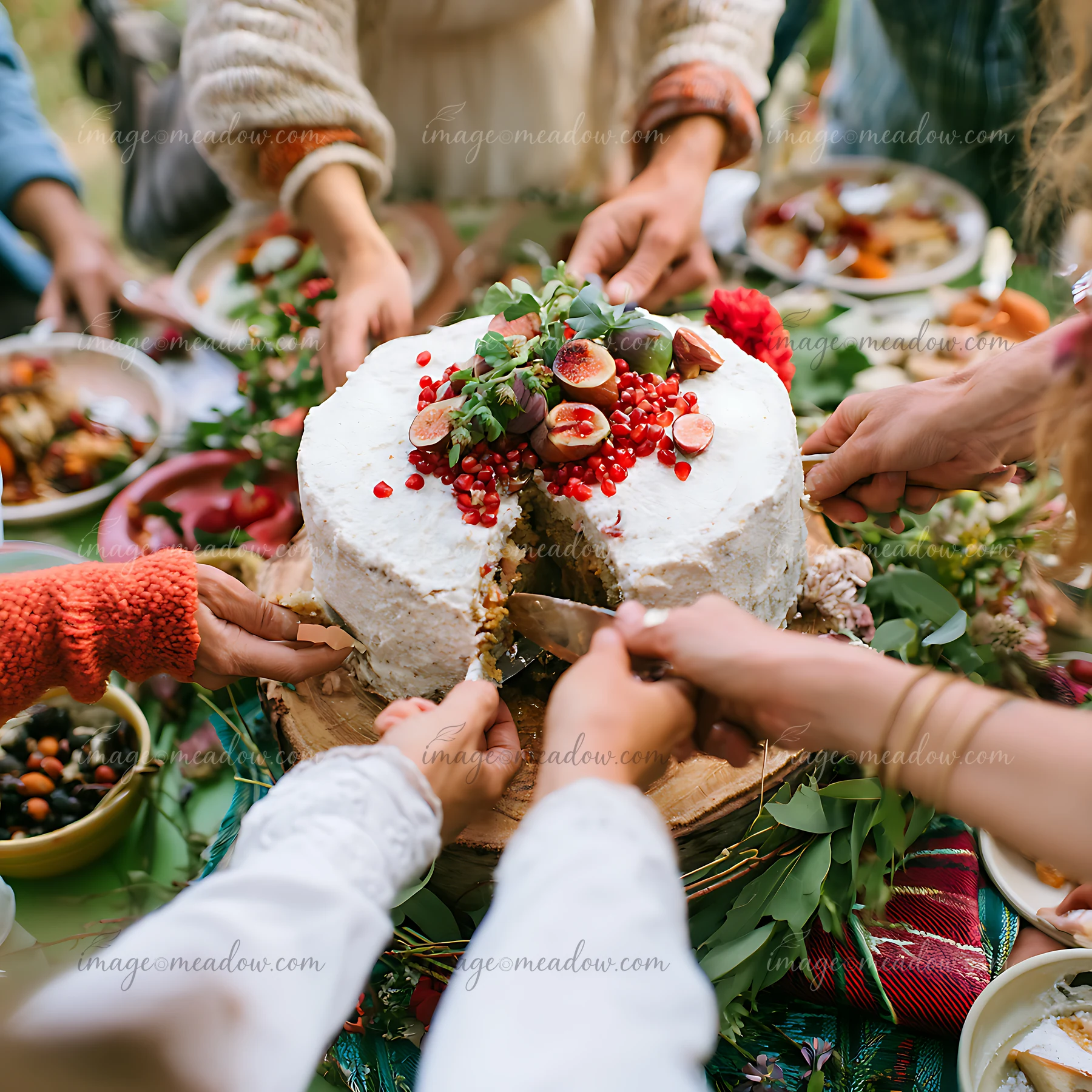 A group of guests cut and serve a vegan wedding cake during a reception.