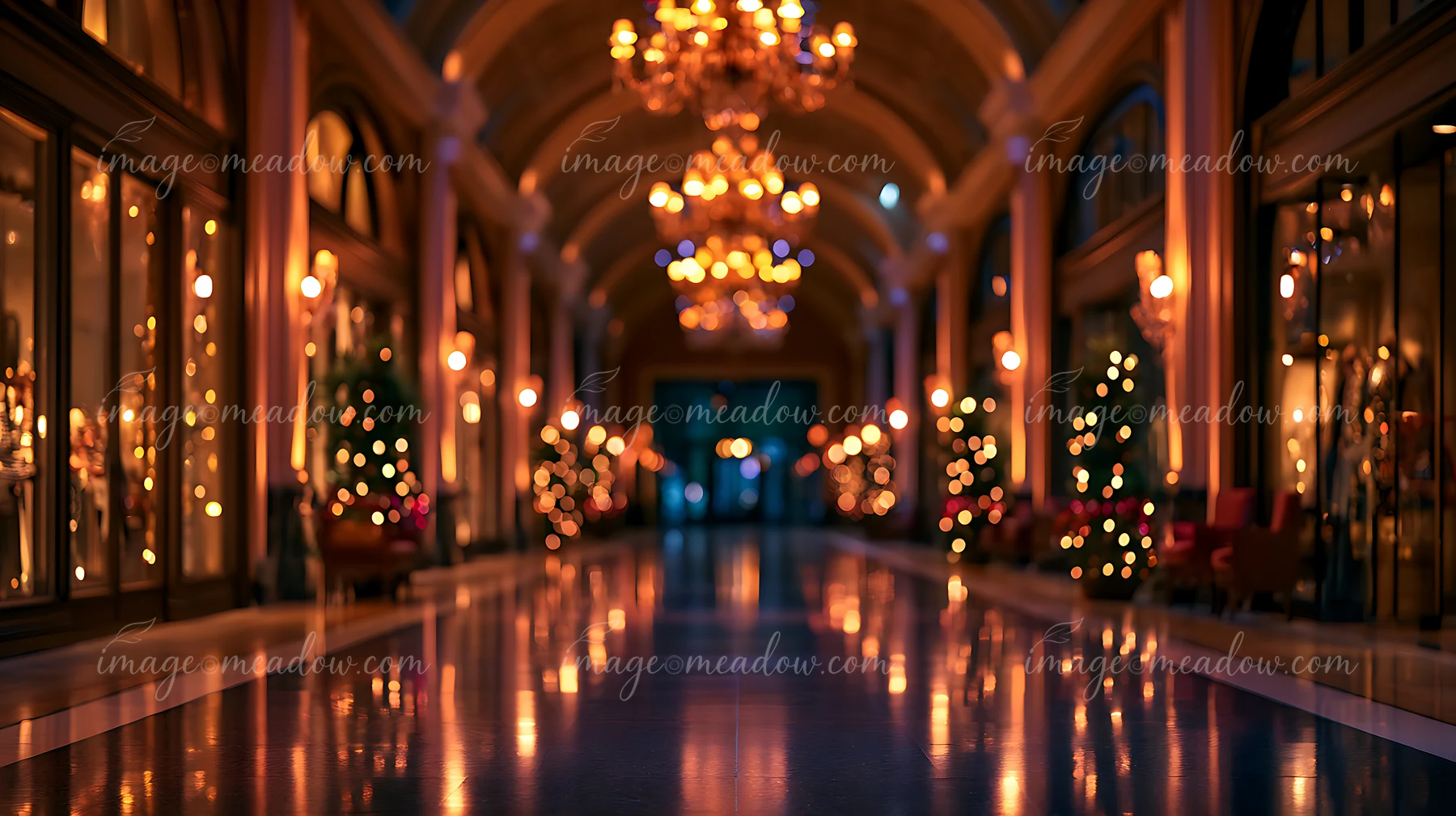 A long hallway features glowing chandeliers and trees adorned with lights.