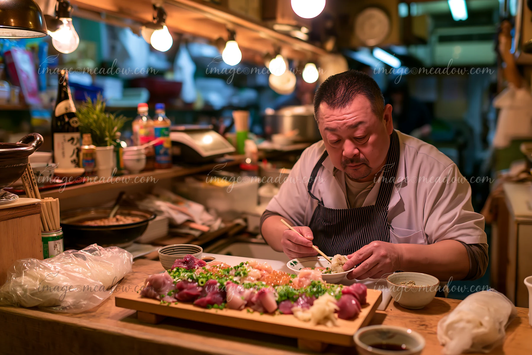 A man sits at a counter in a diner preparing to eat a traditional sushi breakfast in Japan.