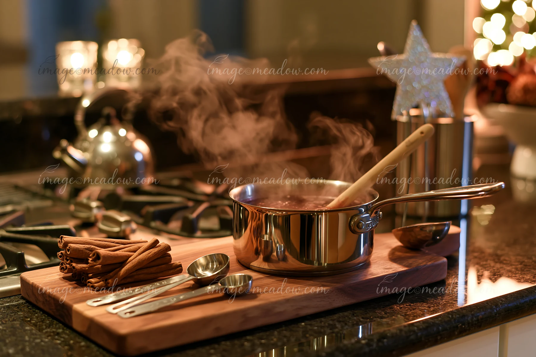 A modern kitchen shows a pot with steam rising on the stove alongside cooking utensils and cinnamon sticks on the counter, creating a festive cooking atmosphere
