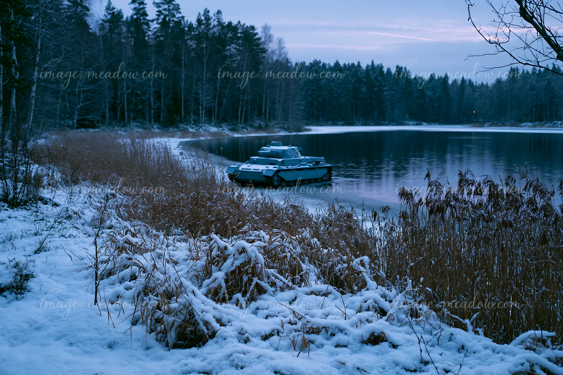 A panzer tank in winter snow moves along the shoreline of a frozen lake, with tall grasses and snow-covered ground in the background.