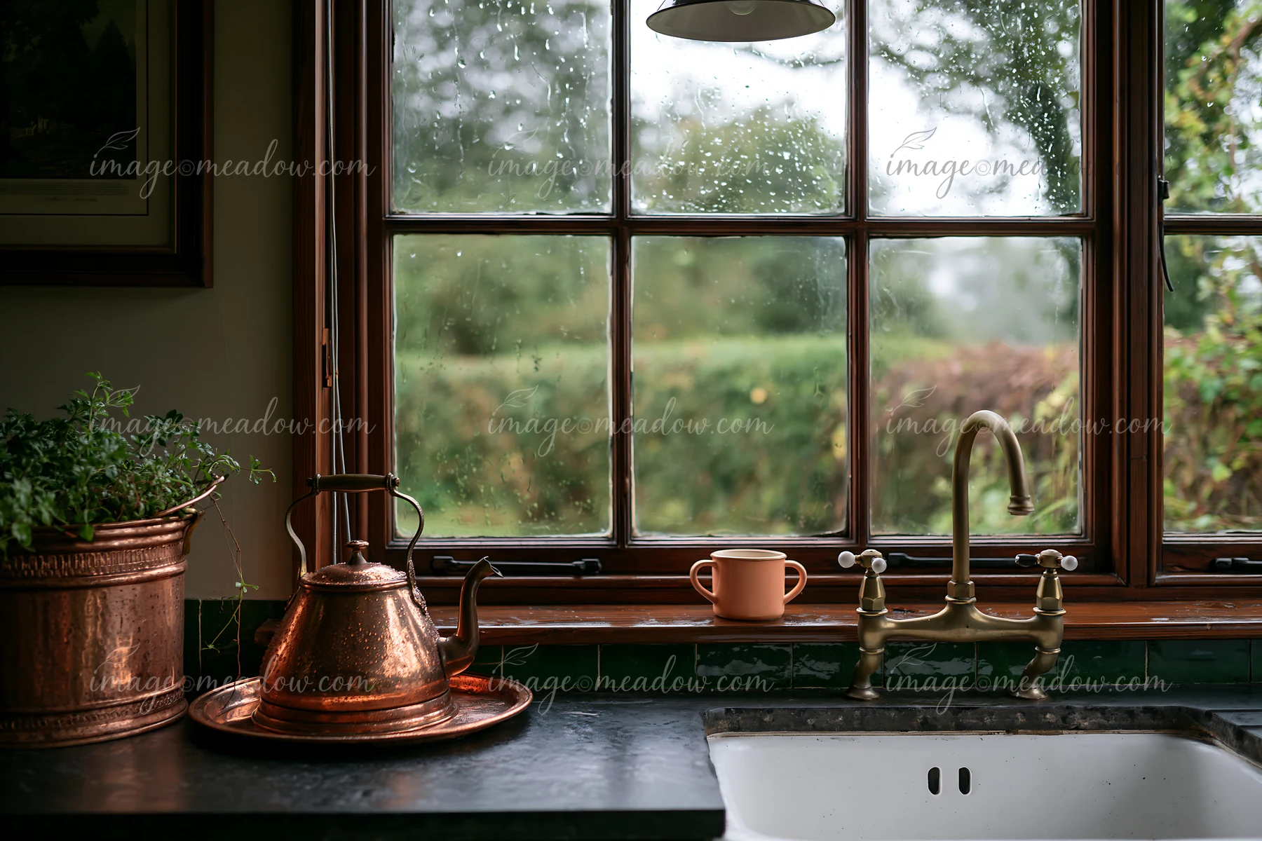 A rain-soaked wooden window in rural home shows a kettle and mug on a counter.