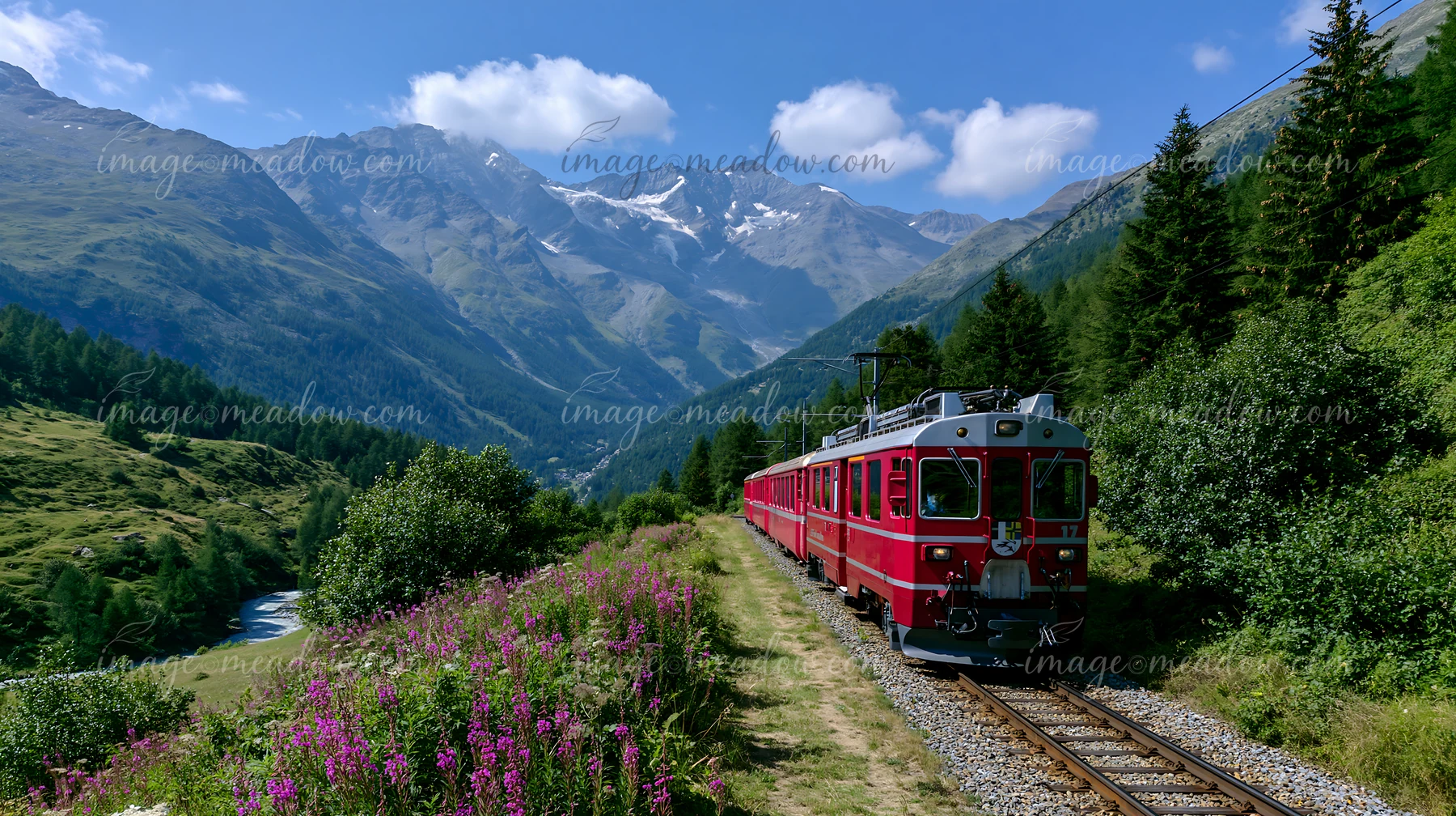 A red cog railway train travels along tracks in a mountainous area.