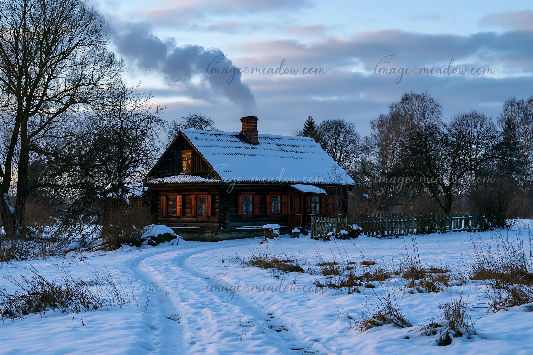 A rustic house with wooden shutters stands in a snowy landscape at dusk.