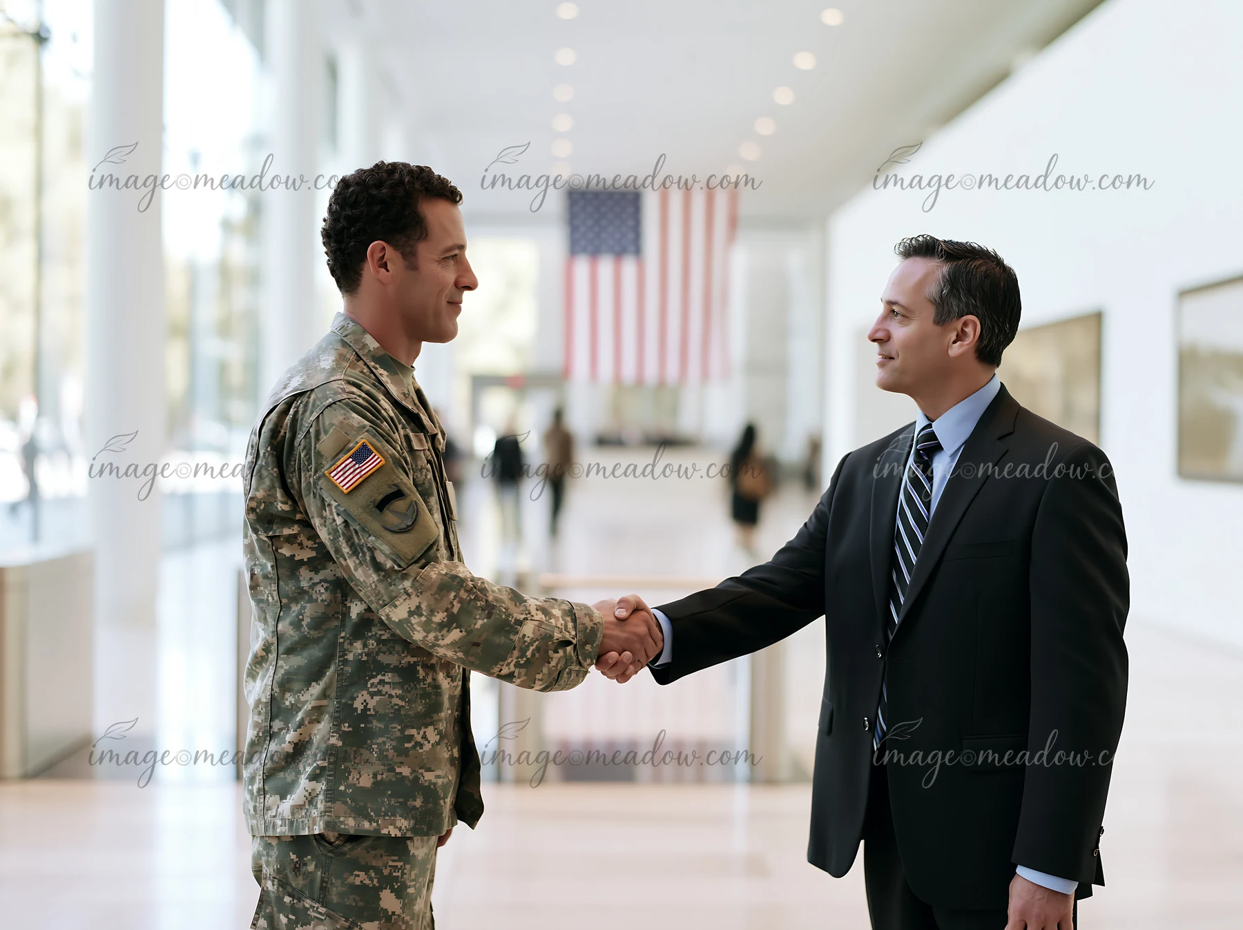 A soldier shaking hands with a businessman in a modern building.