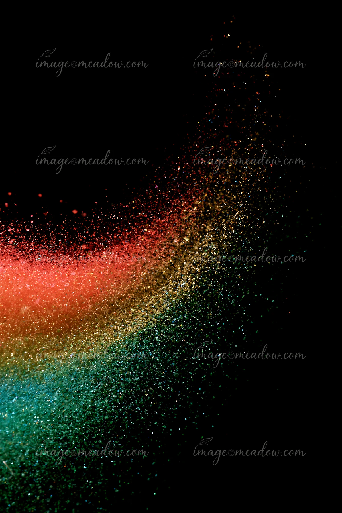 A swirl of colored salt and glitter creates an abstract pattern against a black background, showcasing vivid colors and fine textures.