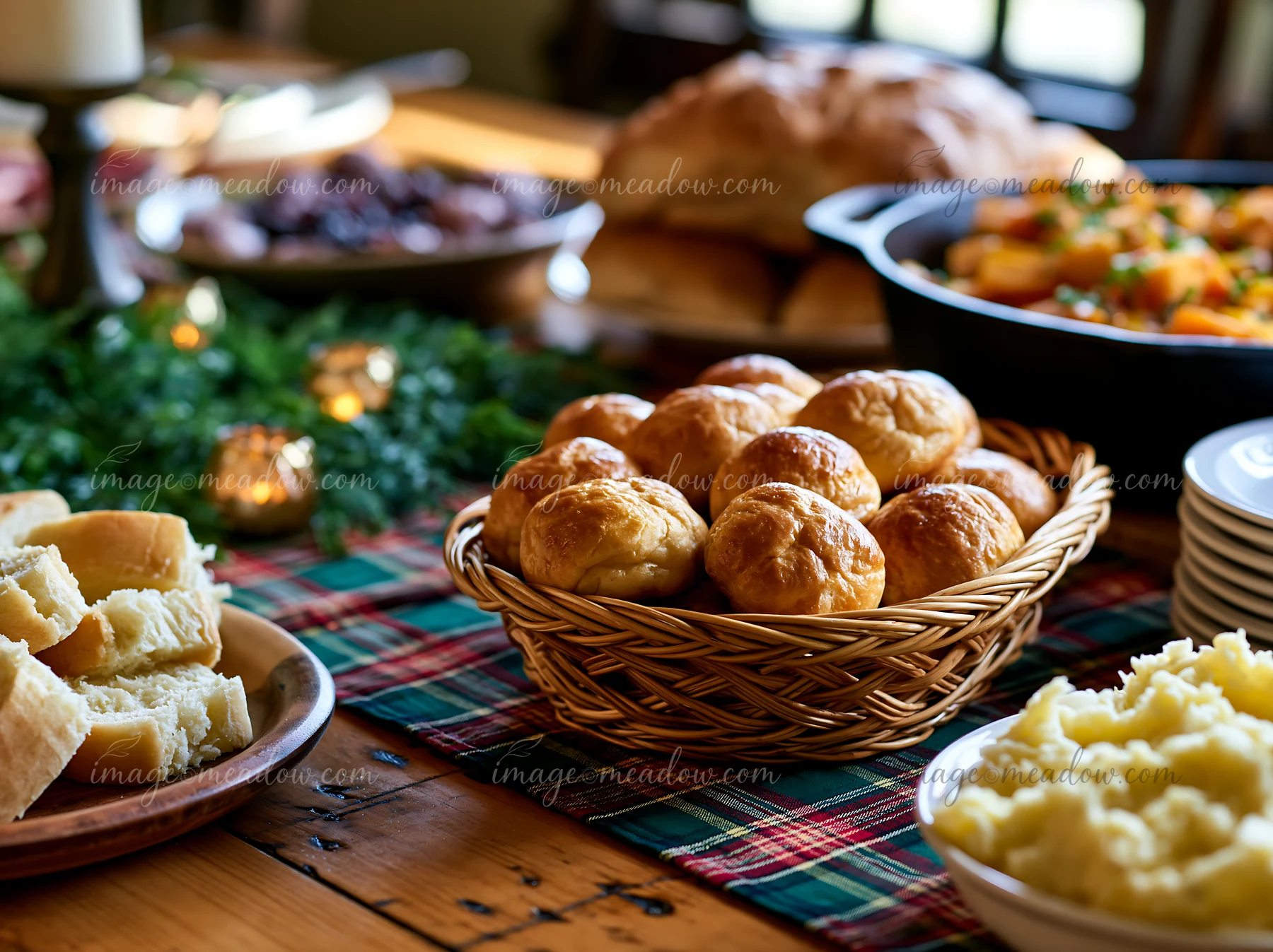 A table displays a holiday buffet dinner featuring various dishes.