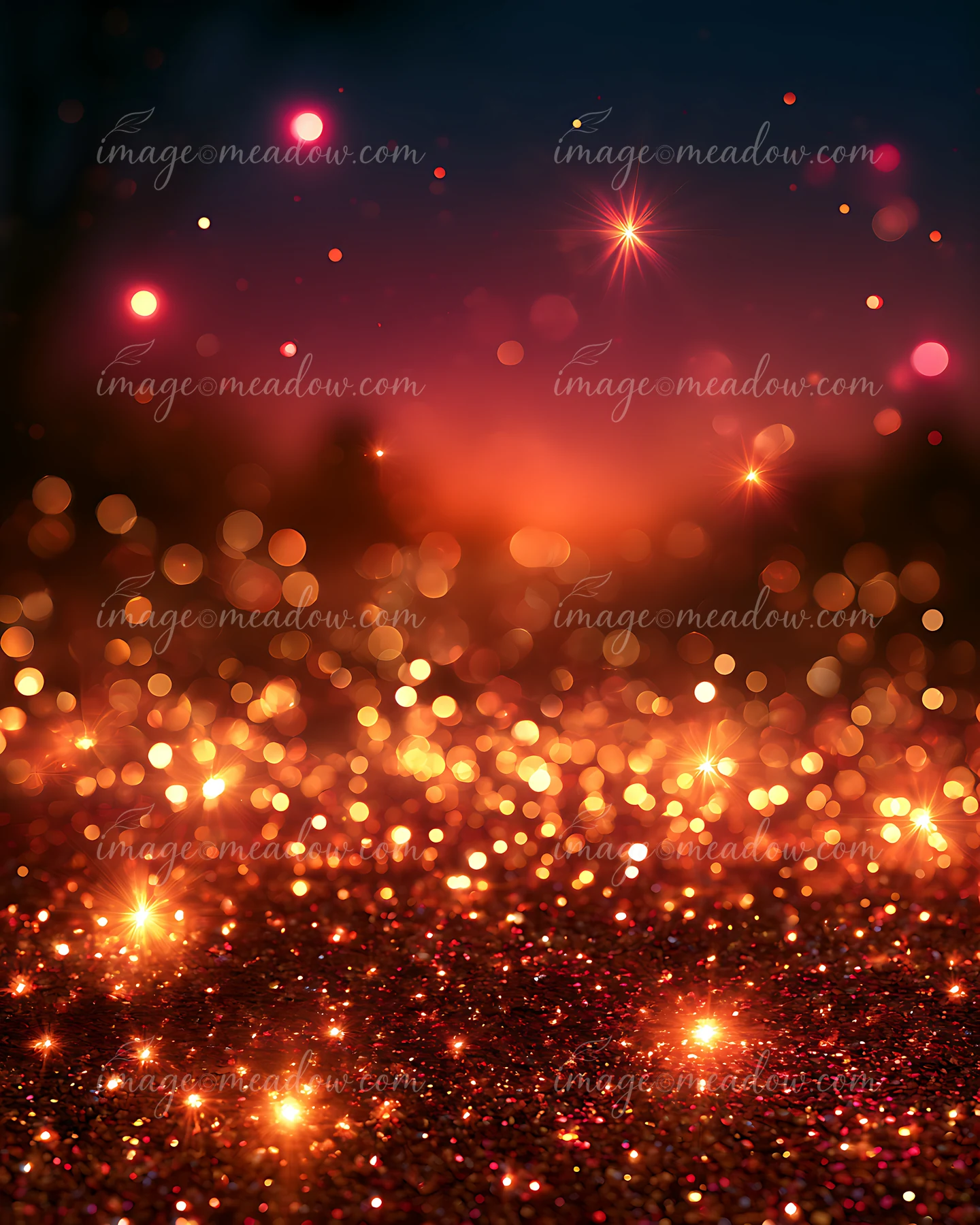 A vibrant mix of warm colors creates a bokeh effect in dim light, with sparkling elements scattered throughout.
