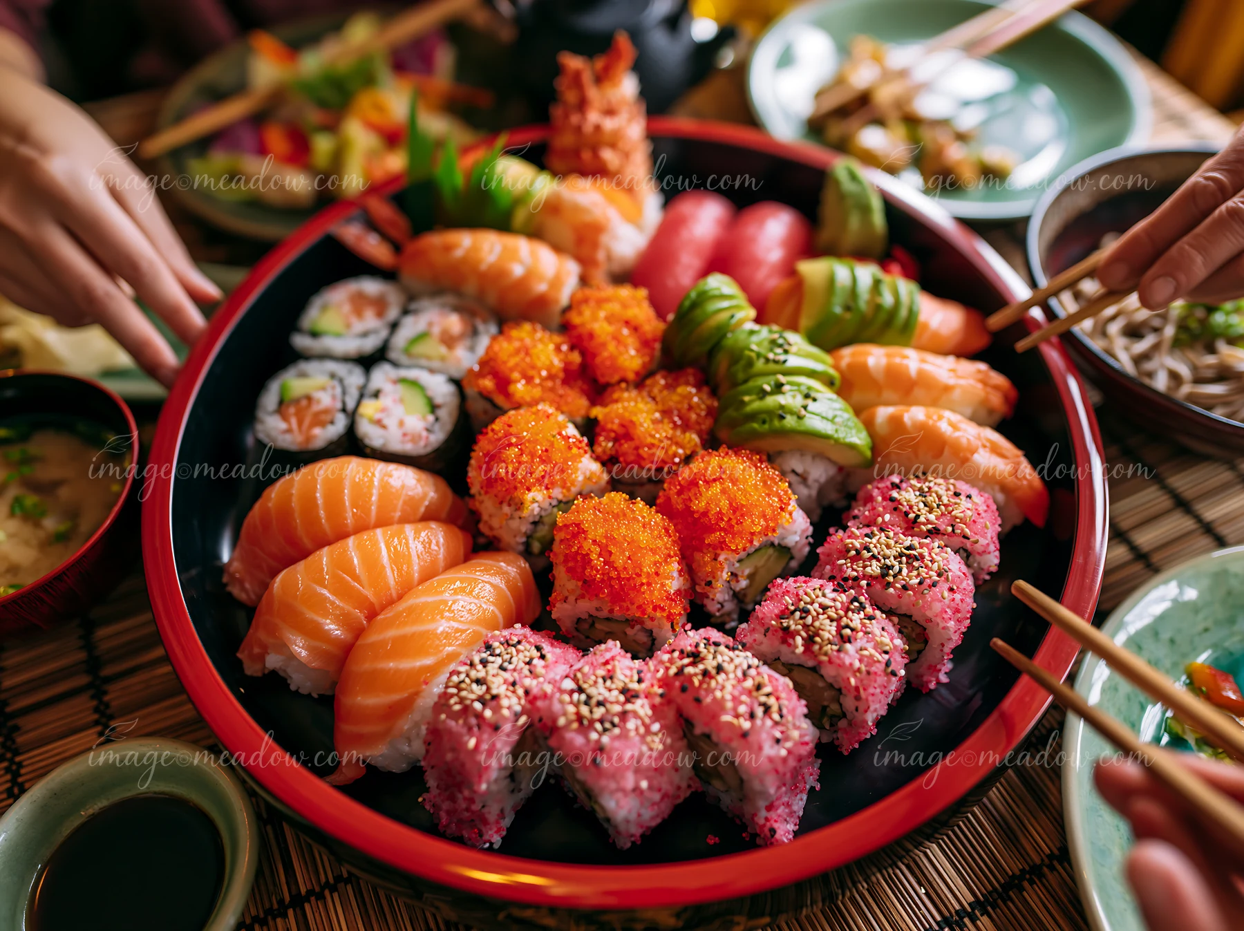 A vibrant sushi platter showcases an assortment of sushi rolls, including tobiko roe sushi platter, alongside colorful garnishes.