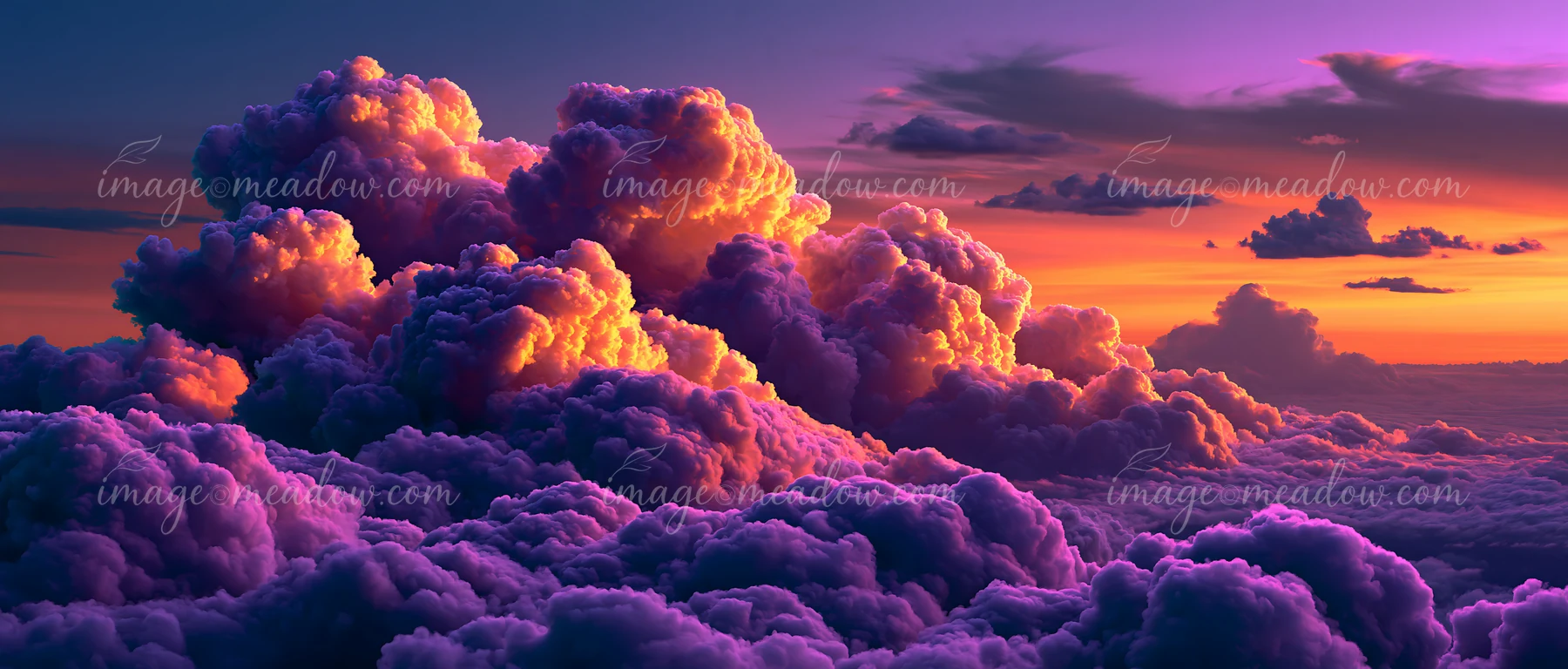 A view of vibrant, colorful clouds filling the sky at sunset, showing a mix of purple, orange, and pink hues.