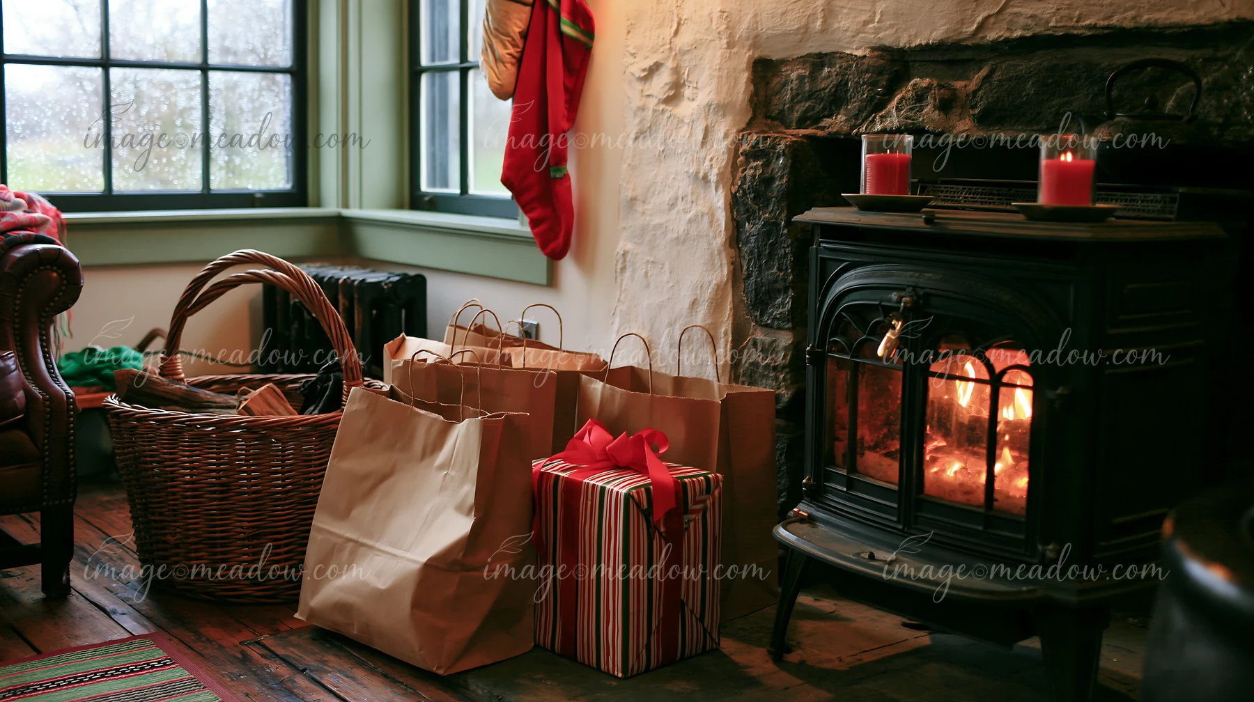 Brown shopping bags and a gift box are by a fireplace in a rustic room.