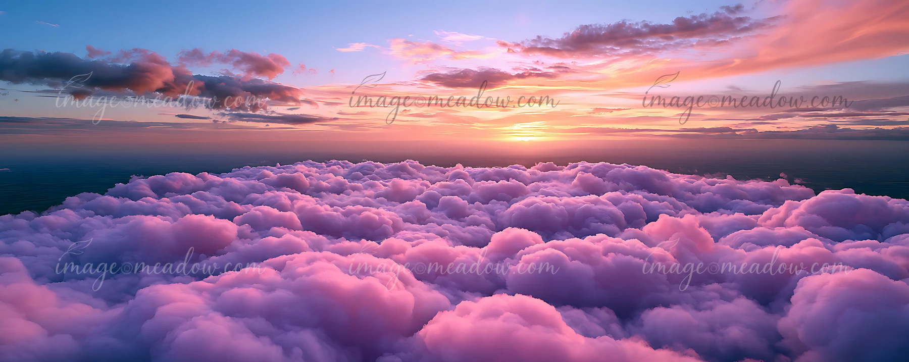 Clouds fill the sky during sunset, displaying shades of pink and purple.