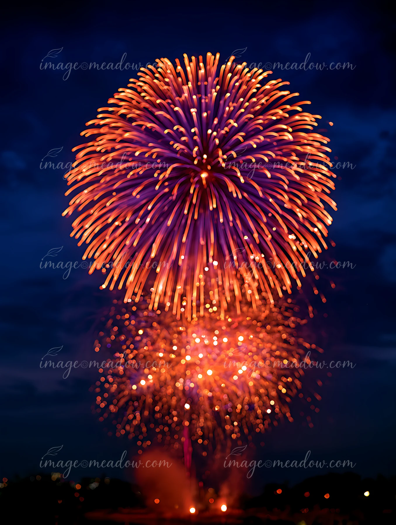 Fireworks light up the night sky with vibrant colors during a festive event.