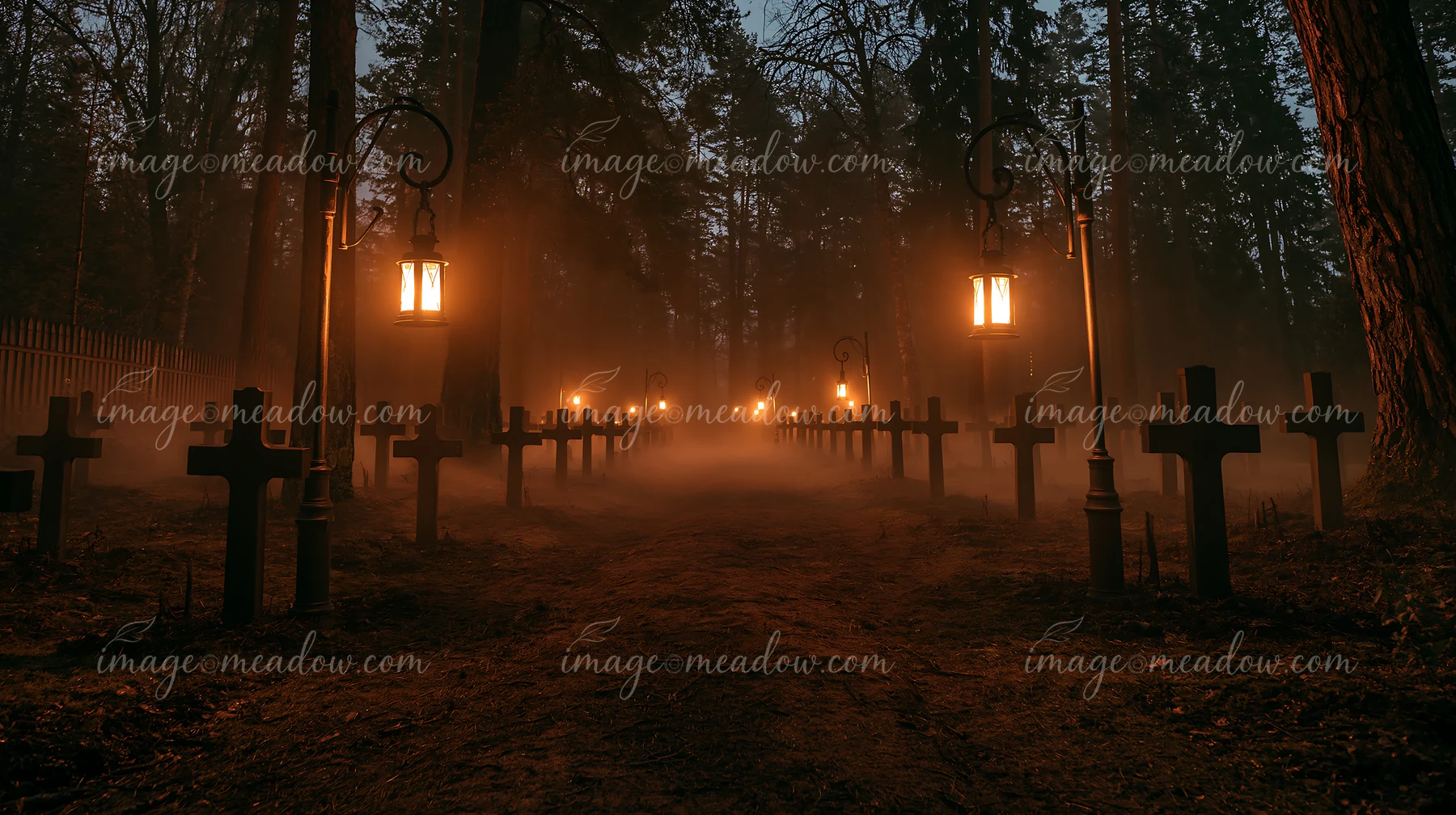 Lanterns light up military graves beside a forest at night, creating a somber atmosphere.