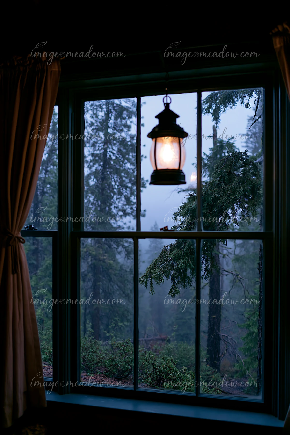 Rain falls outside a cabin window.