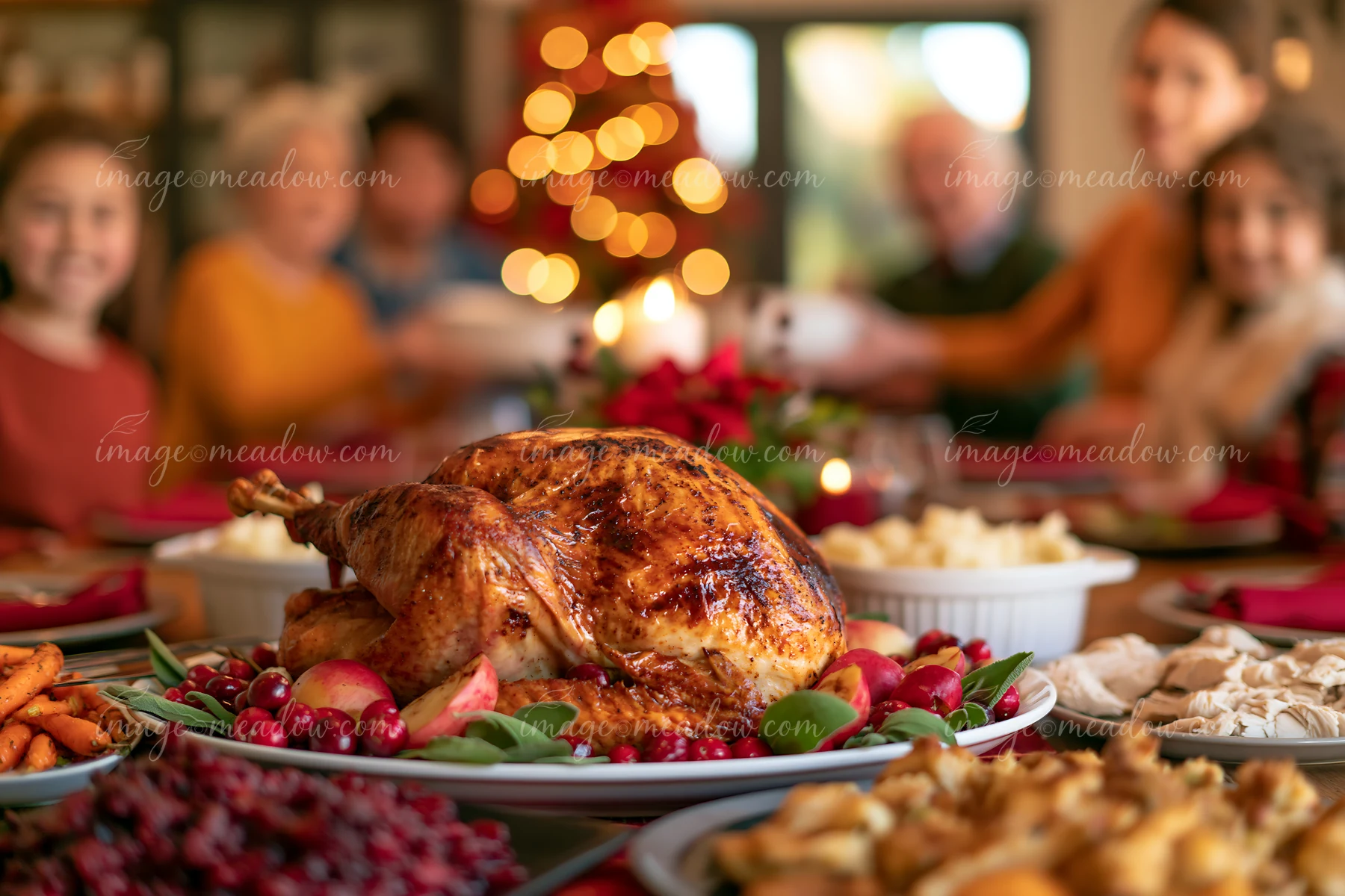 Roasted turkey on festive dining table is surrounded by various side dishes.