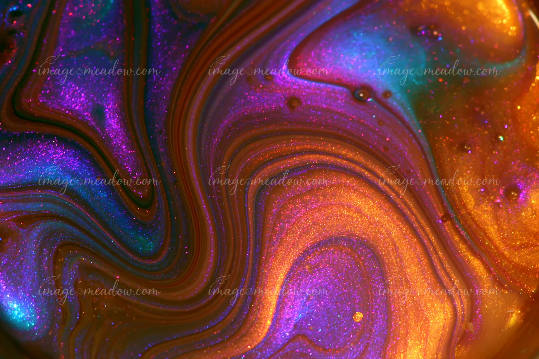 The colorful abstract swirl glittering pattern features vivid shades of purple, blue, and orange with shiny details that create an artistic effect.