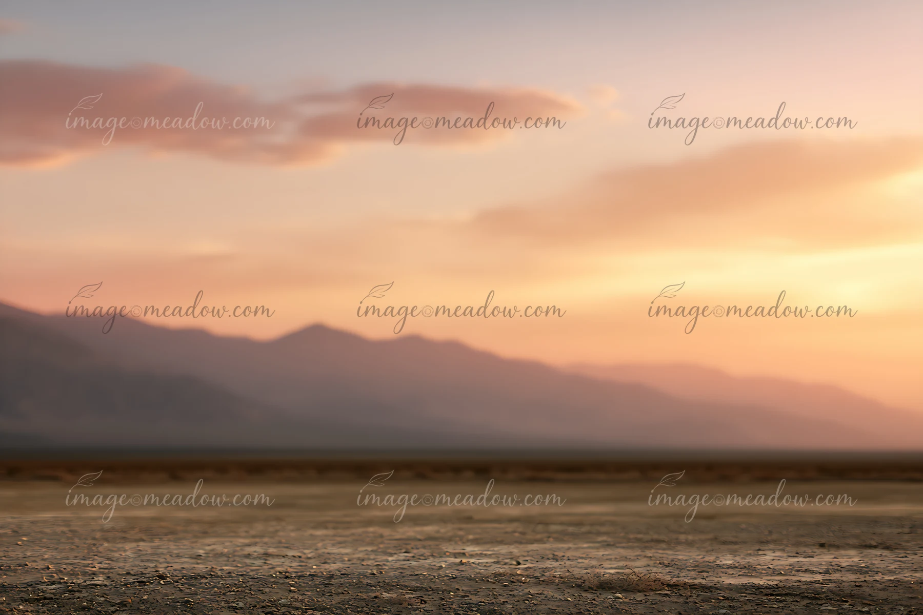 The scene shows a dry desert landscape with a flat terrain under a colorful sunset.