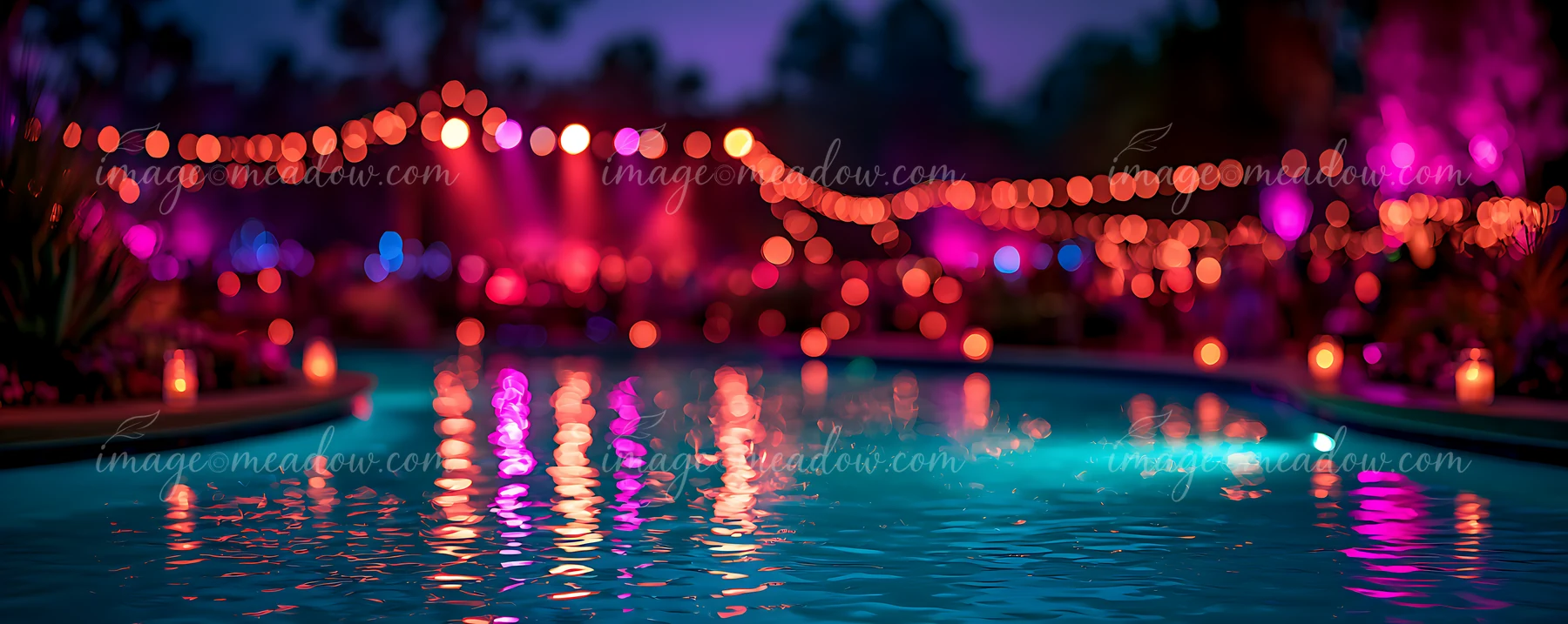 The scene shows a pool with clear water reflecting vibrant lights and decorations.
