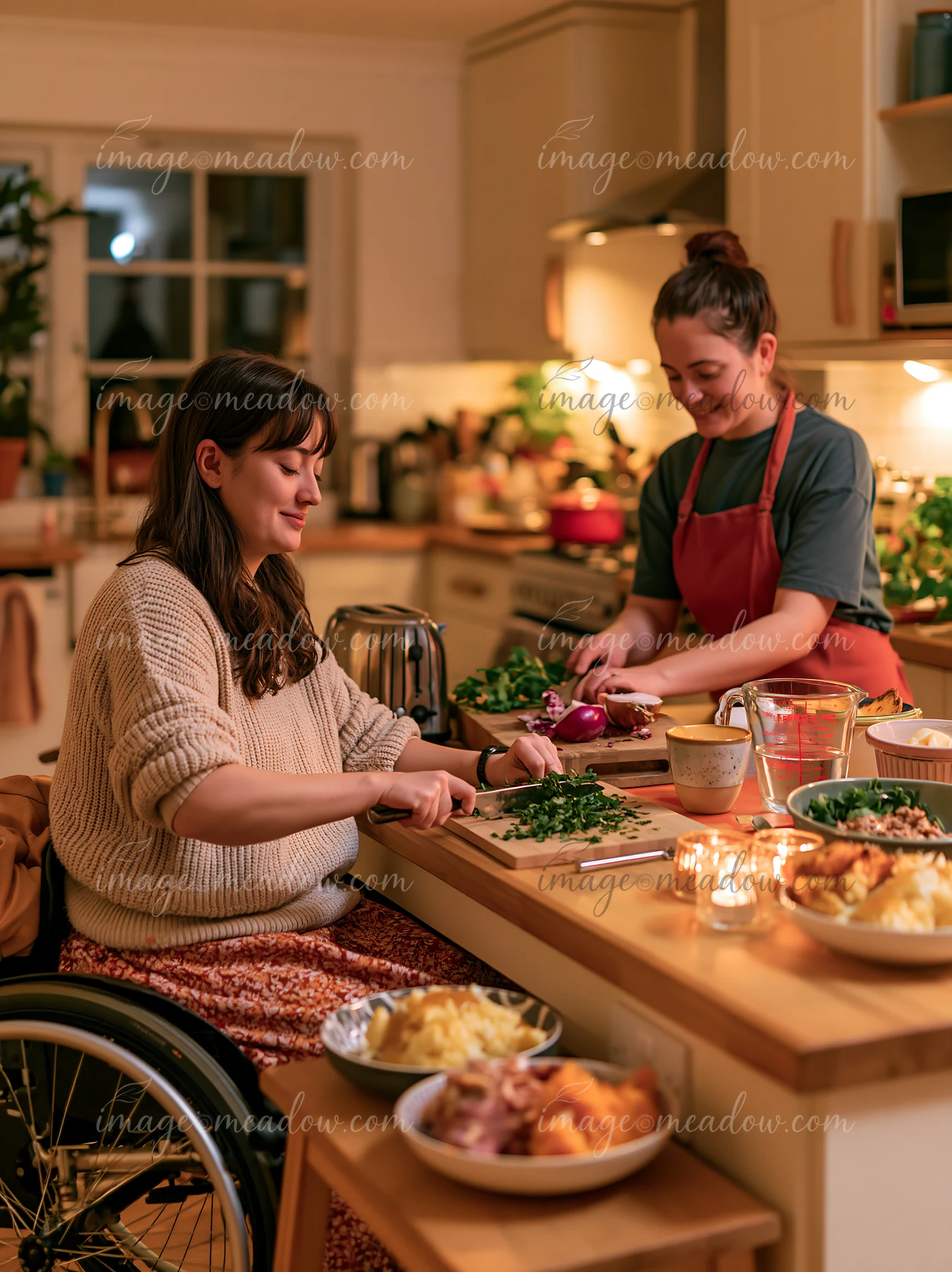 Two women are preparing food together in a bright kitchen while getting ready for Christmas dinner.