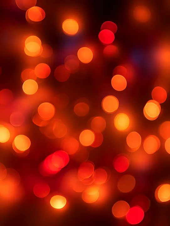 Colorful lights in shades of red and orange fill the background, providing a vibrant and warm ambiance suitable for celebrations or events.