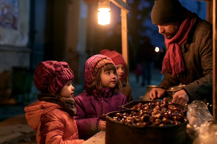 A family at food stalls interacts with a vendor in a nighttime market setting.