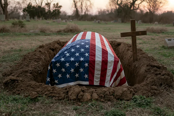A mournful scene shows an American flag-draped coffin positioned beside an open grave in a cemetery.