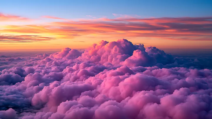 The sky is filled with fluffy clouds that show shades of pink and orange during sunset.